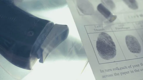Fingerprint card on CSI expert table Stock Footage 86413560