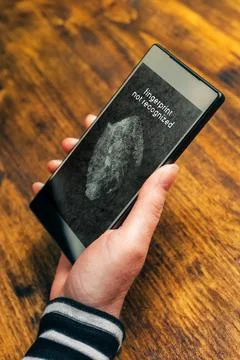 Fingerprint not recognized message on mobile smartphone device screen Stock Photos