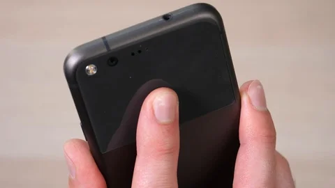 Fingerprint Reader Being Used on The Back of a Smartphone Mobile Device Video stock 90016296