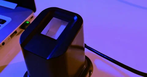 Fingerprint reader turn on to access a security system near a notebook pc Video stock 275826360