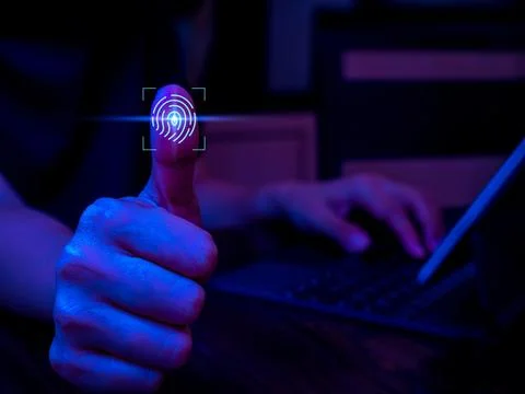 Fingerprint scan icon on virtual screen while finger scanning for security .. Stock Photos