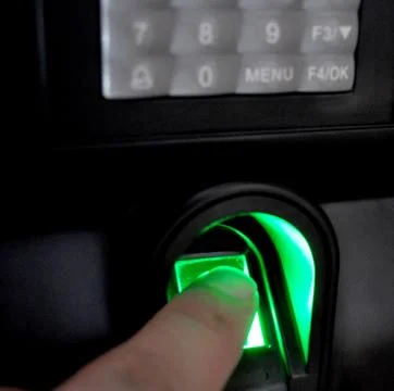 Fingerprint scanner to record working time Stock Photos