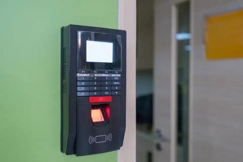 Fingerprint scanner on wall to record working time or enter security system Stock Photos