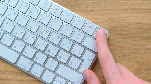 Fingerprint sensor unlocking a computer through Touch ID. Hand authenticati.. Stock Footage 340283689