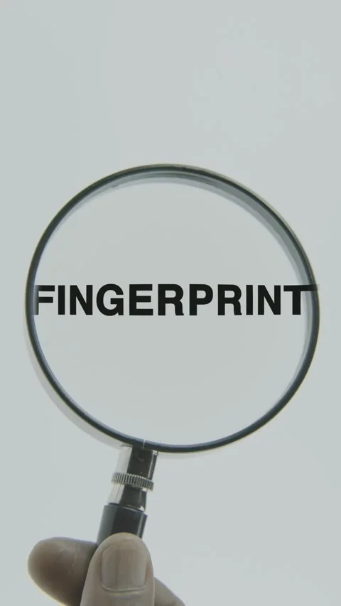 Fingerprint text or word highlighted by a magnifying glass in a hand Stock Footage 303447735