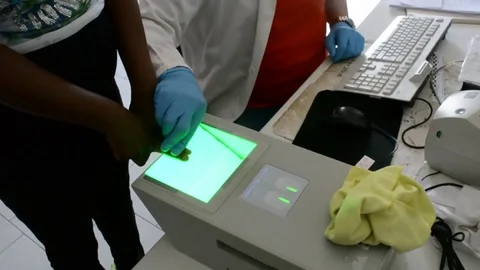 Fingerprints identification operations of refugees Stock Footage 77004507