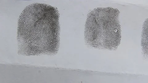 Fingerprints on a sheet of paper close-up. Stock Footage 173028939