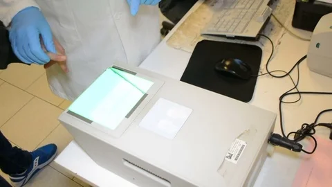 Fingerprints, taking fingerprints on scanner for identification 库存影片 83977772