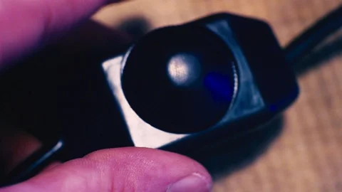 Fingers adjust the brightness of the light with the dimmer switch.close-up Stock Footage 87666477