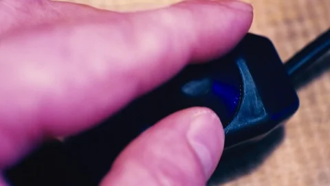 Fingers adjust the brightness of the light with the dimmer switch.close-up Stock Footage 87666954