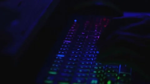Fingers are highlighted in different colors. Work at night on a multi-colored Stock Footage 217013162