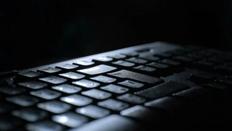 Fingers on a black keyboard backlit Stock-Footage 88761577