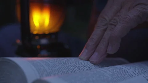 Fingers on Book with Latern Stock Footage 208746439