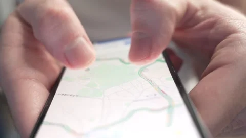 Fingers Browsing Google Maps App on a Smartphone Screen Stock Footage 261322098