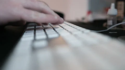 Fingers chatting on keyboard of a computer Stock Footage 64035888