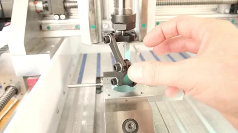 Fingers check the alignment and motion of a machine part Stock Footage 314815901