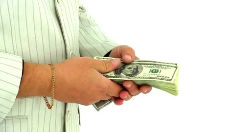 Fingers counting a stack of dollar bills on a white background. hands counting a Stock-Footage 336261054