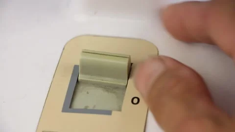 Fingers flip toggle the retro switch, select fan speed two one zero, close-up Видео 157594979