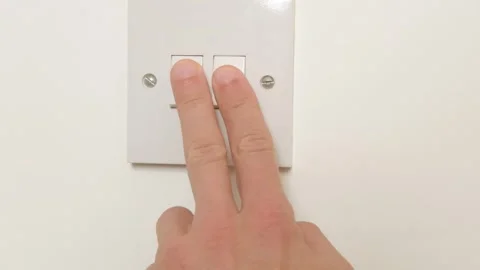 Fingers flipping switch, demonstrating electrical safety, electrical safety.. Stock Footage 308511795
