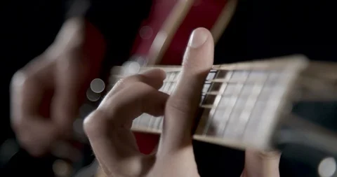 Fingers on a guitar neck close up Vídeo Stock 101698016