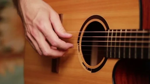 Fingers on the guitar's strings 스톡 동영상 72814564