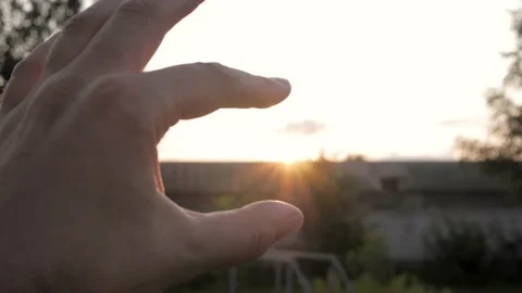 Fingers Of The Hand Grip Sun At Sunset Stock Footage 130211580