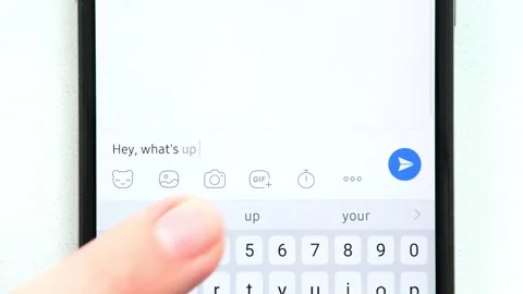 Fingers of hand write on screen of mobile phone message to interlocutor "Hey, wh Stockbeeldmateriaal 248028889