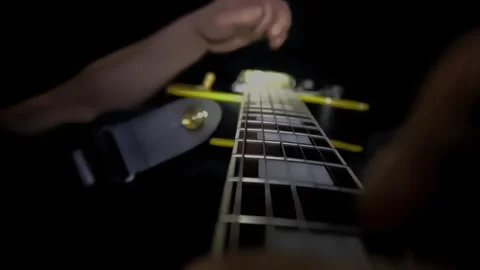 Fingers hitting strings on electric guitar, close up neck fretboard. Guitarist Video stock 259301404