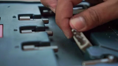 Fingers inserting a screwdriver bit into its case slot. Tool footage Stock Footage 346222505