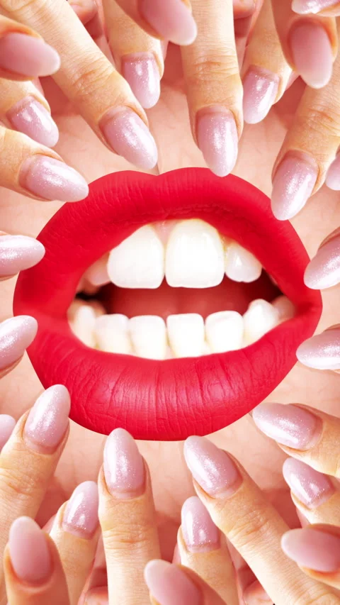 Fingers made into a hypnotic circular pattern with red lips in vertical Stock Footage 263982839