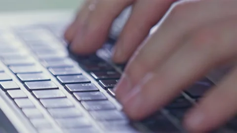 Fingers of man pushing buttons of keyboard to type text Stock Footage 229845870