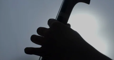 Fingers musician silhouette playing cello stringed instrument Stock Footage