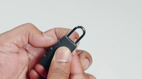 Fingers Open A Combination Lock Stock Footage 248711496