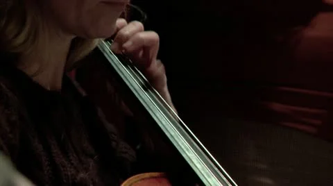 Fingers play fast across the strings of a Cello Stock Footage 10872382
