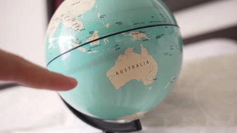 Fingers Pointing to Australia on a Globe Stock Footage 284396922