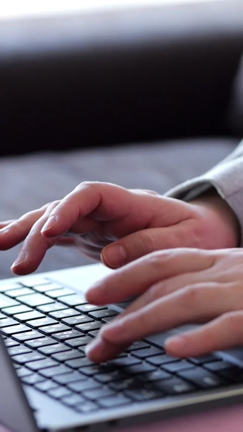 Fingers Press Laptop Keys While Working Indoors. Busy Worker Operates Portable Stock Footage 347193094