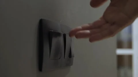 Fingers press on light switches Stock Footage 342863580