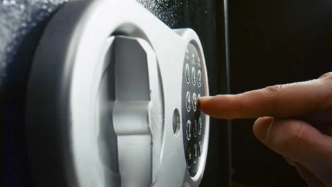 Fingers pressing code safe electronic panel close up. Man entering password. Stock Footage 232593476