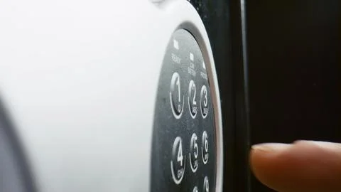 Fingers pressing code safe electronic panel close up. Man entering password. Stock Photos