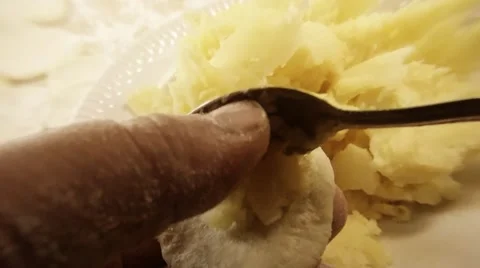 Fingers Put With Spoon Potatoes in Piece of Paste Mould Varenik Behind Plate Stock Footage 66447753