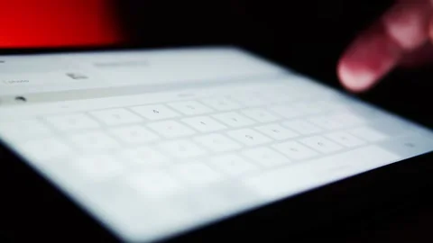 Fingers quickly typing on a tablet. Business emailing on a touch screen devic Stock Footage 162374878