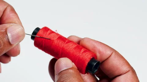 Fingers Red Thread And Needle Stock Footage 248702993