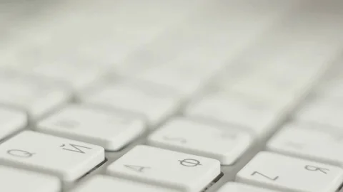 Fingers of a Russian programmer or hacker typing on a white computer keyboard Stock Footage 74492398