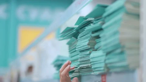 Fingers on a stack of thin notebooks Video stock 126866480
