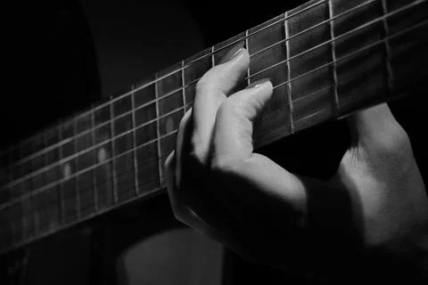 Fingers on strings Photos