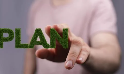 Fingers tapping on a screen with 3D rendered word PLAN with mossy texture, a Foto stock
