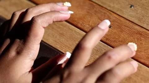 Fingers tapping wooden table, rhythmic dry knocking sounds Stock Footage 329479519