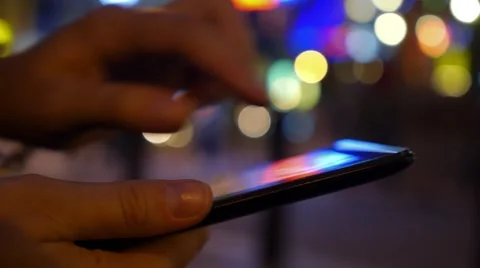 Fingers Touching Screen of Digital Tablet on Blurred Night Lights Видео 54633890