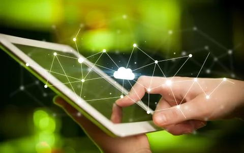 Fingers touching tablet with cloud concept Foto stock