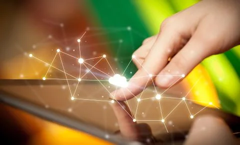 Fingers touching tablet with cloud concept Foto stock